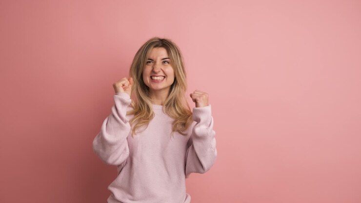 Pensive woman with hand on chin looking up distracted