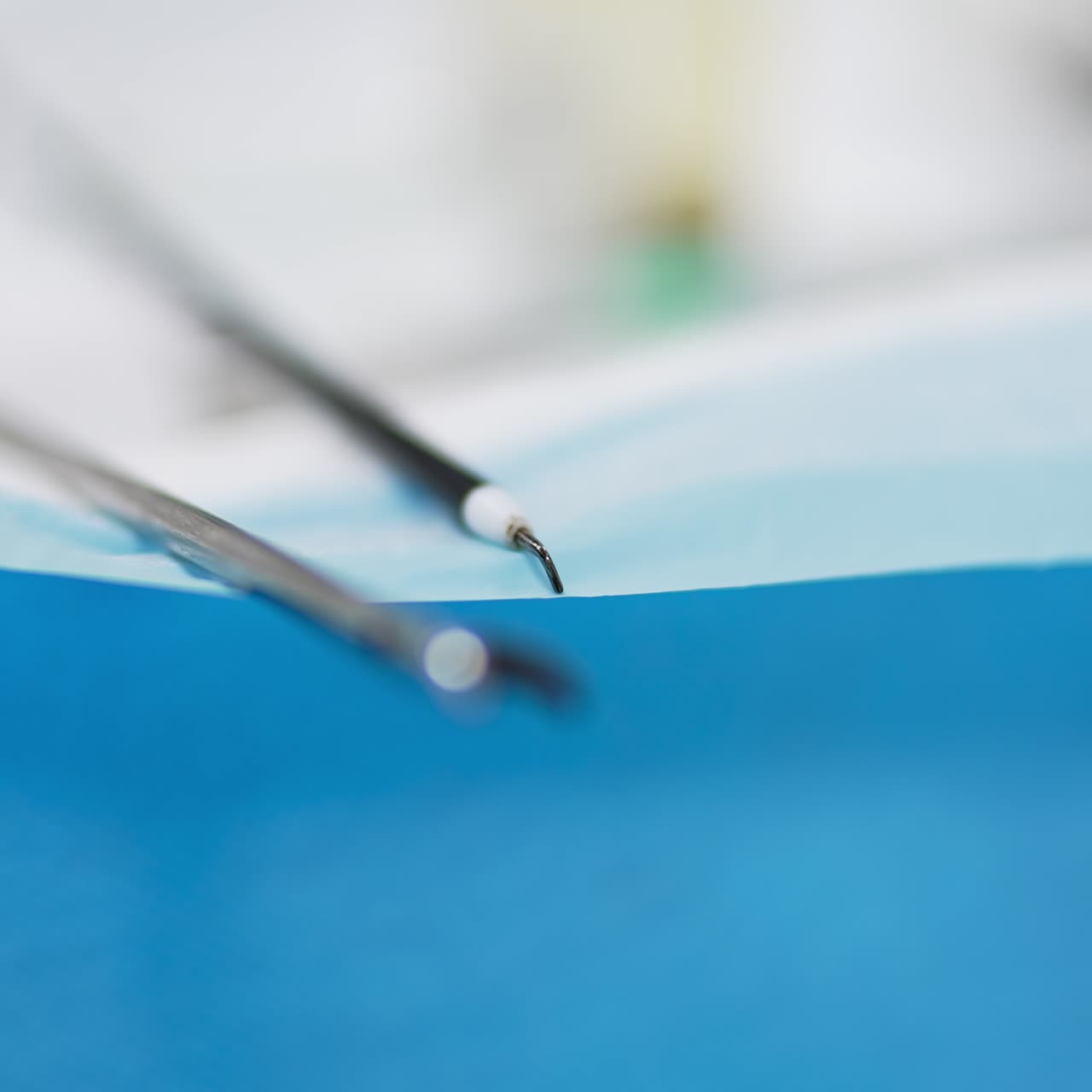 Instruments and tools prepared for surgery. Devices at the table close up. Blurred foreground transforms into blurred backdrop