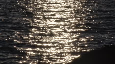 shimmering waters with sunlight reflections at sunset