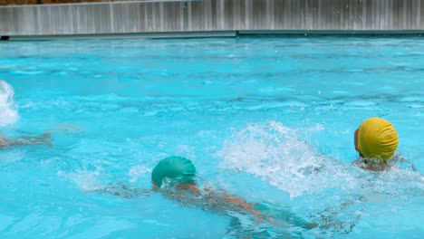 kids swimming in the swimming pool