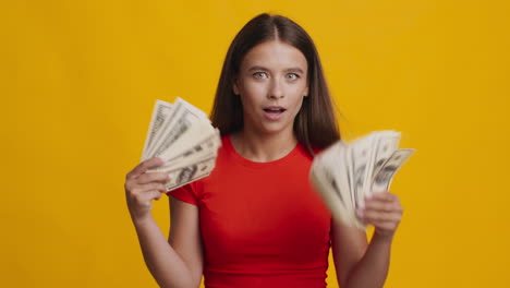 woman celebrating with money