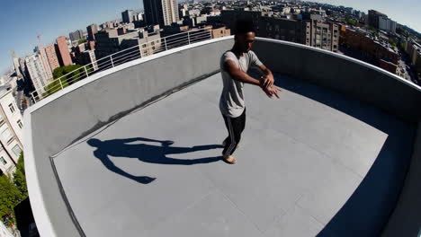 dynamic barefoot movement on a city rooftop