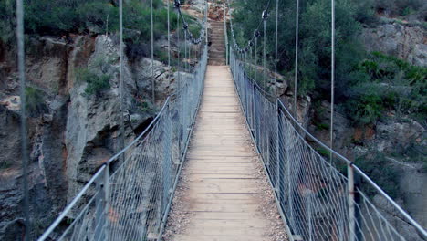 Wooden Suspension Bridge Over Canyon