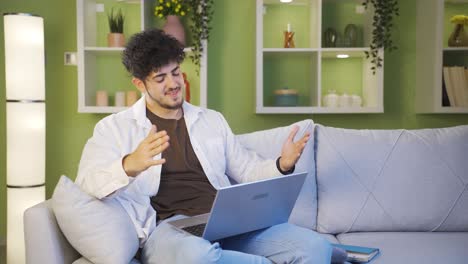 Young-man-chatting-with-his-girlfriend-on-laptop.