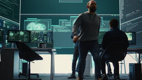 Group of governmental hackers analyzing digital threats on pc networks