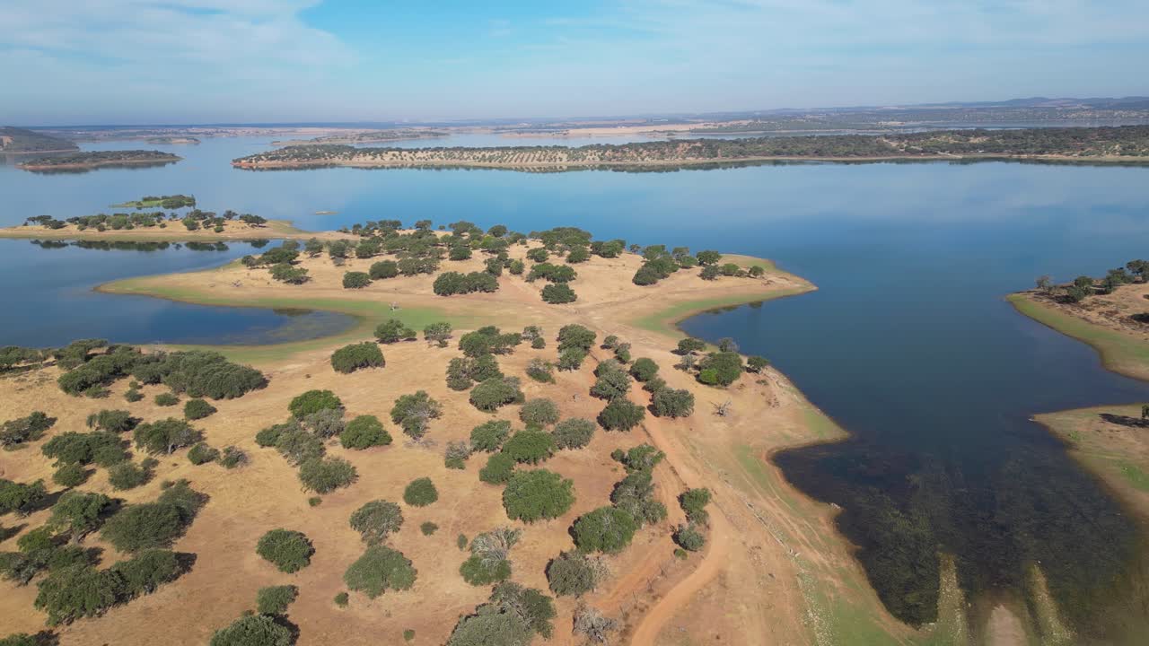 Barragem do Caia. Aerial view of the stunning reservoir in Alentejo, Portugal. Islands dot the blue waters, creating a unique and picturesque landscape. Perfect for nature, travel, scenic projects.