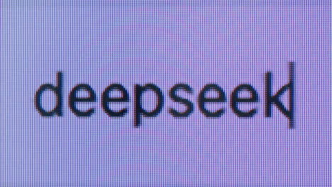 deepseek text on a pixelated computer screen