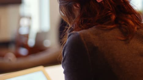 woman using digital tablet