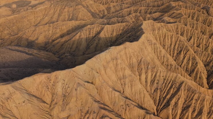 Valley Of Forgotten Rivers With The Red Rocks Of Ak-Sai Canyon, Kyrgyzstan. Aerial Wide Shot