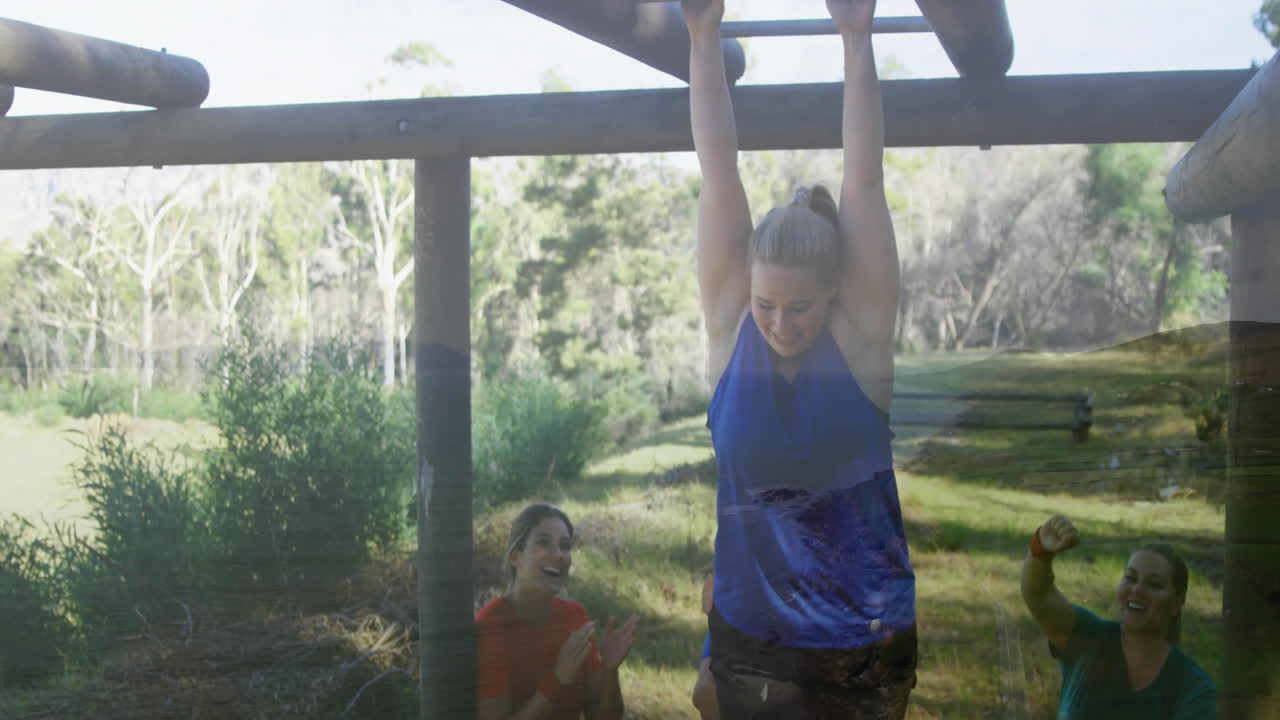Hanging from monkey bars, woman in park with friends cheering animation