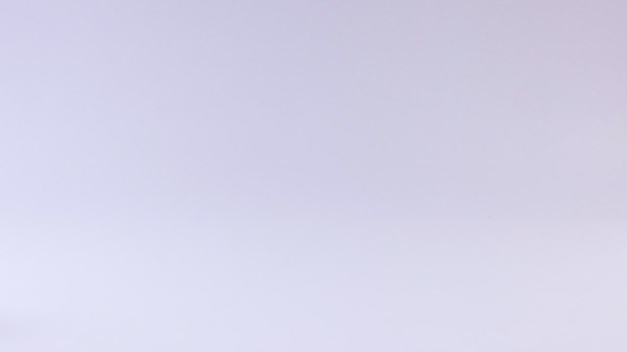 A blue tennis ball bounces repeatedly