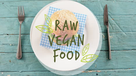 animation of raw vegan food text over fresh hamburger