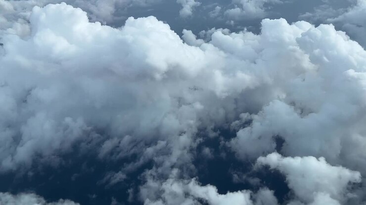 Aerial cockpit lateral view of some sumulus clouds over Mediterranean Sea