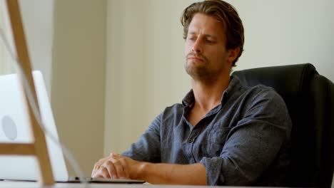 man using laptop at home 4k
