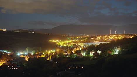 brightly lit czech most city at night in the timelapse video