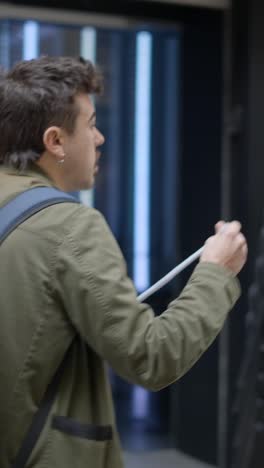 man walking through urban settings with backpack