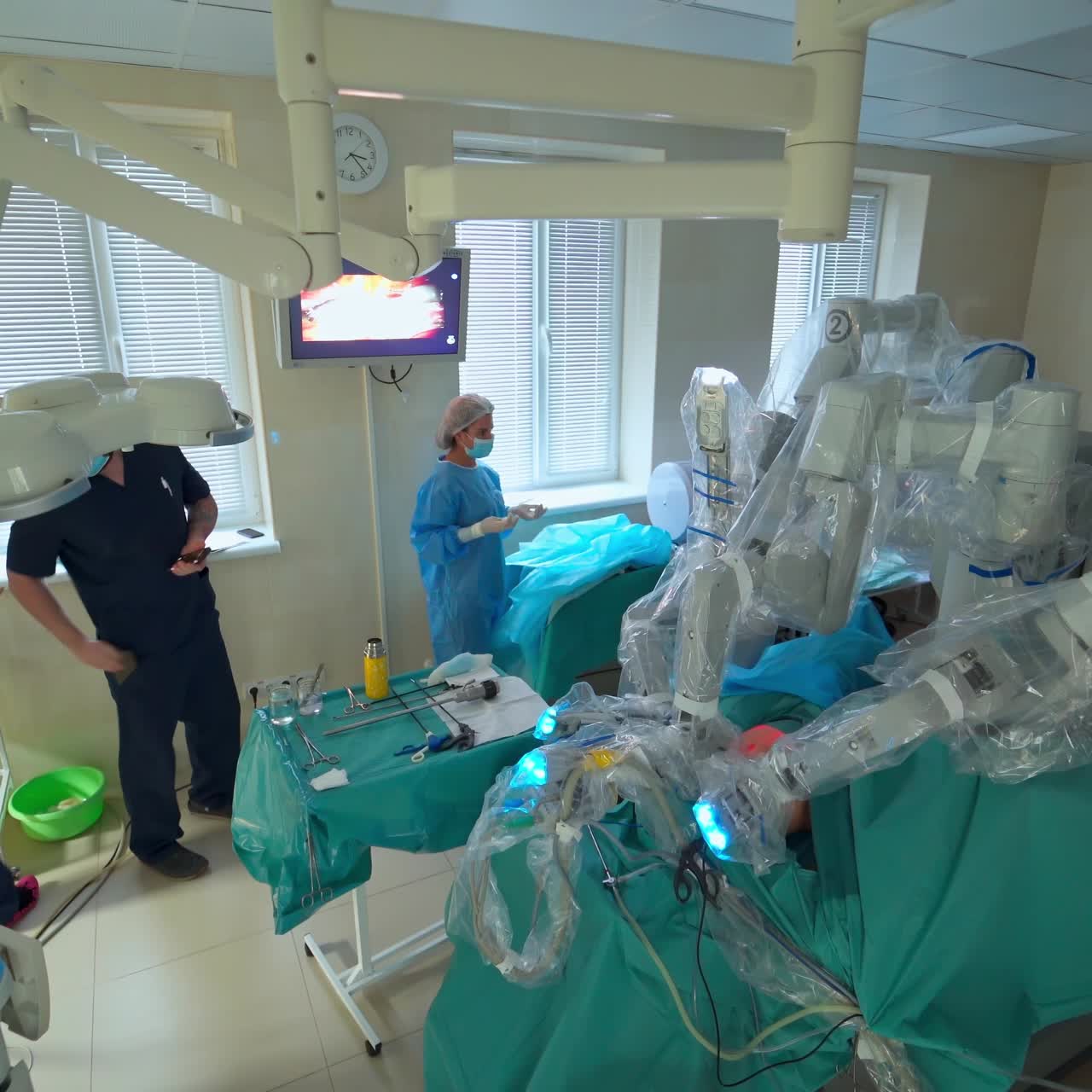 Medical robot performing laparoscopic operation. Machine arm surgeon in futuristic operation room