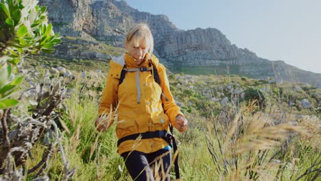 senior woman walking in countryside 4k