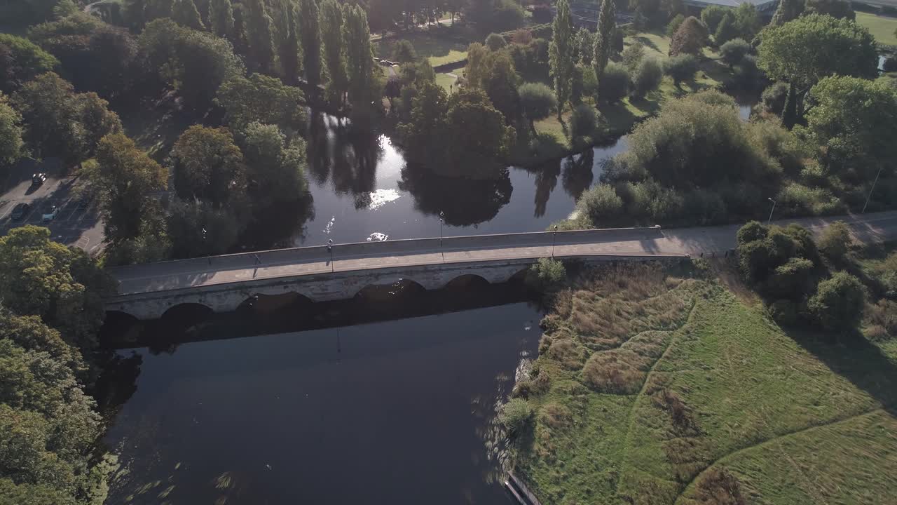 Aerial orbit of river anker and river tame, looking east, above main road in to Tamworth