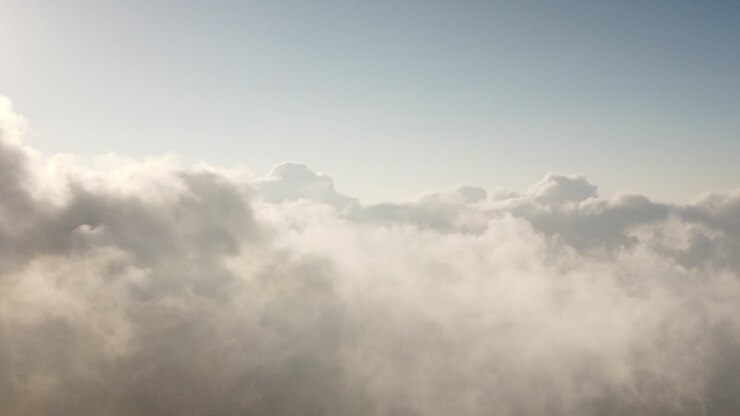 Sunrise above a blanket of dancing clouds high in the mountains of India