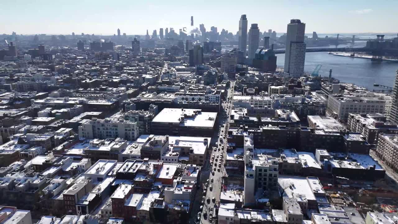Horizontal drone circular-tracking shot over Wythe Ave in Williamsburg, Brooklyn, capturing New York’s lively streets, historic architecture, and stunning urban skyline with smooth aerial motion.