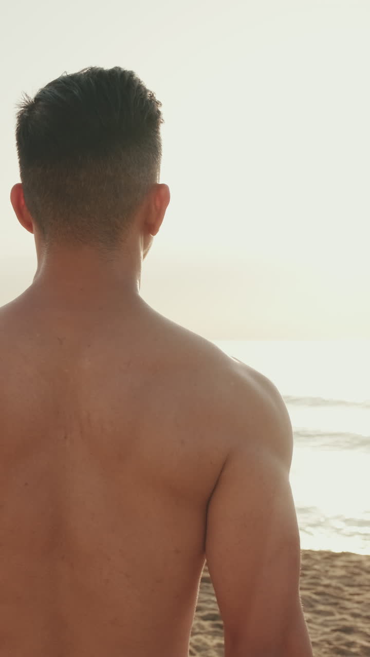 Man doing fitness workout on the beach