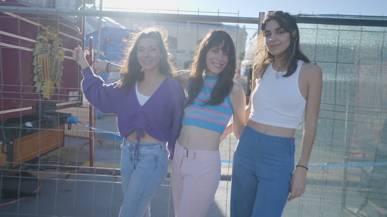 Three friends roller skating outdoors