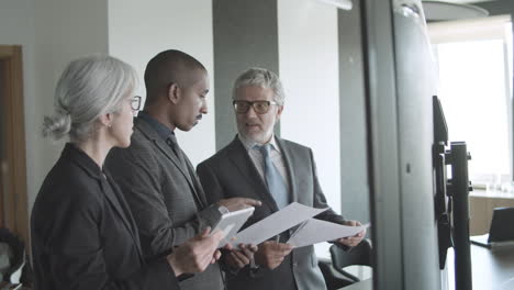 business people with data on a screen