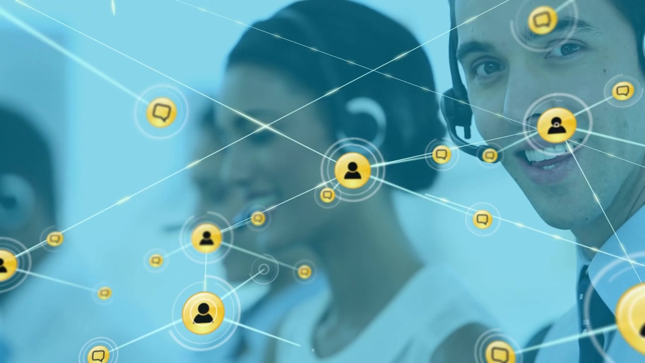 Animation of network of digital icons over caucasian man wearing phone headset smiling at office