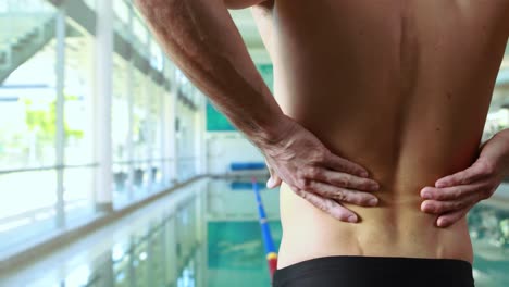 Rear-view-of-a-swimmer-with-back-pain