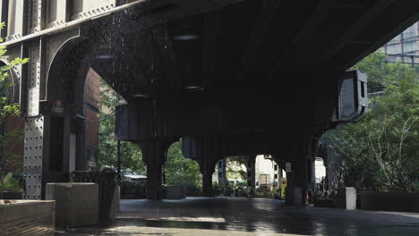 water dripping from a railway underpass in new york, slow motion