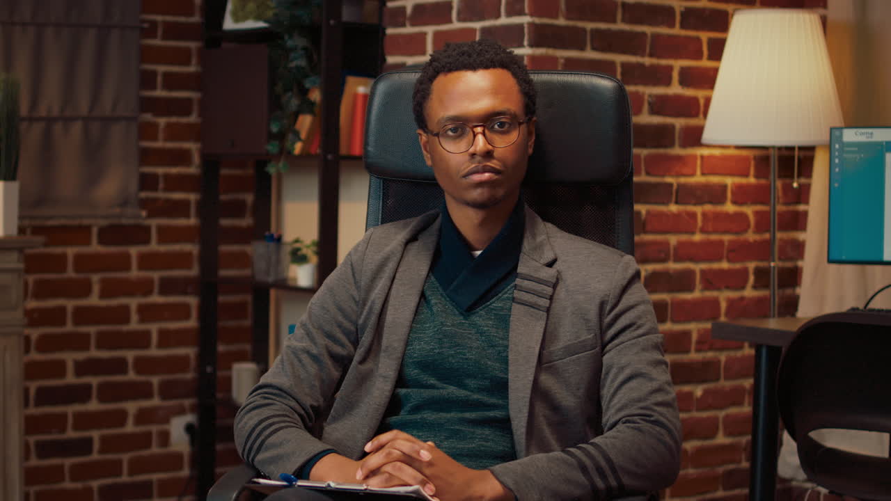 Portrait of psychology consultant sitting in office