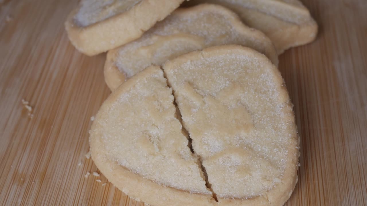 Cracked shortbread on wooden board, calm and quiet mood