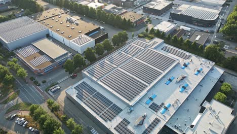 beautiful aerial overview of large warehouse with solar panels on rooftop