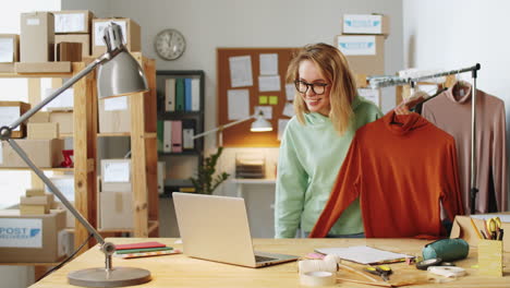 woman presenting clothing online