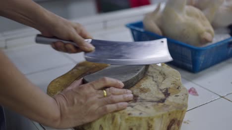 sharpening a butcher knife on a stone