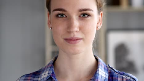 portrait of serious young woman looking at camera