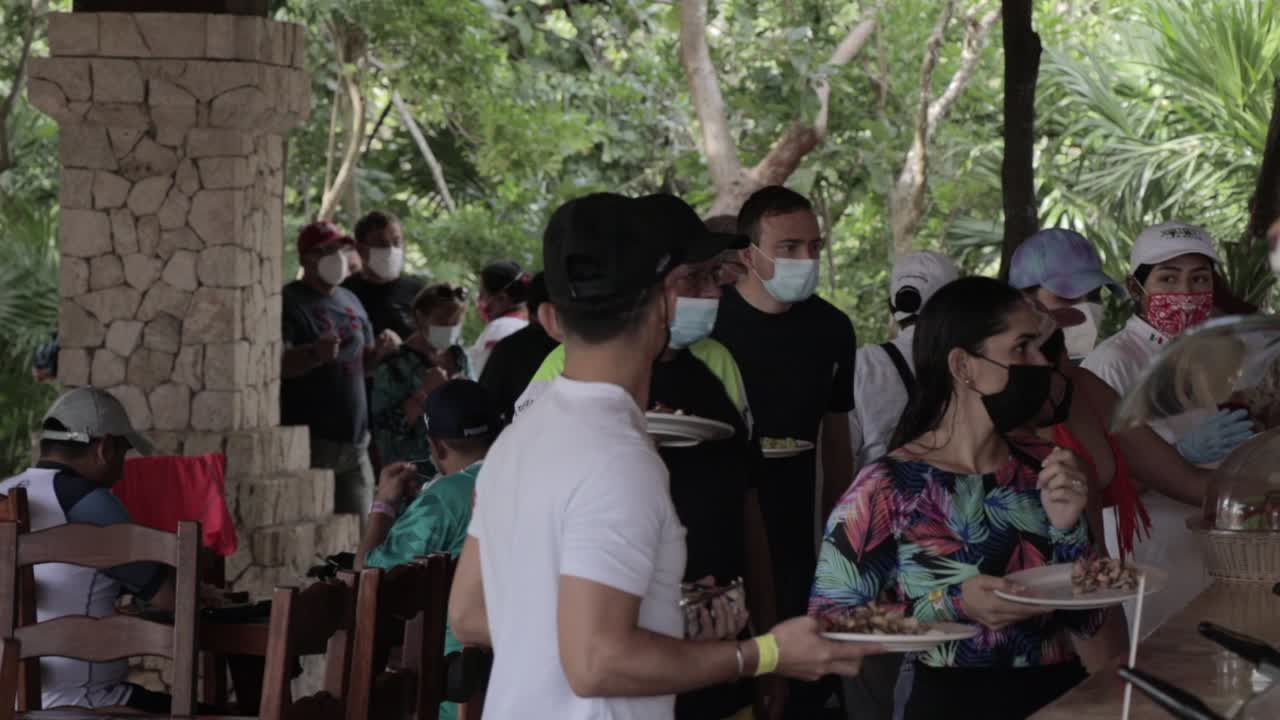 People at Buffet Restaurant with Face Masks at Xcaret Mexico