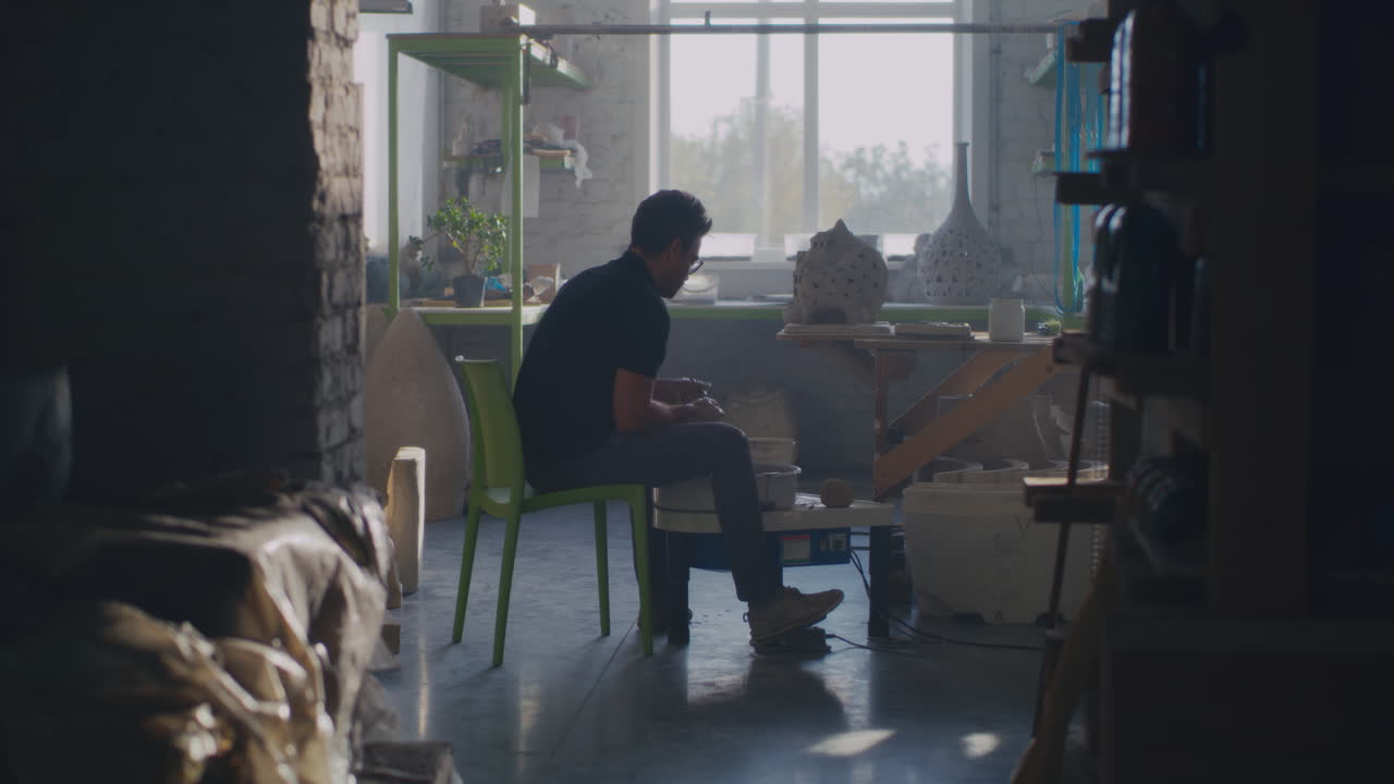 Pottery Artist Working in a Studio