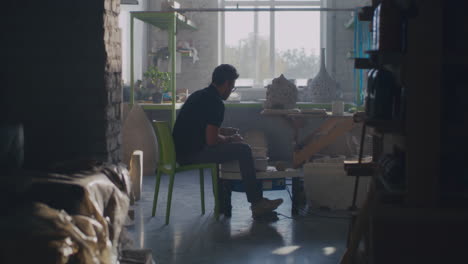 pottery artist working in a studio