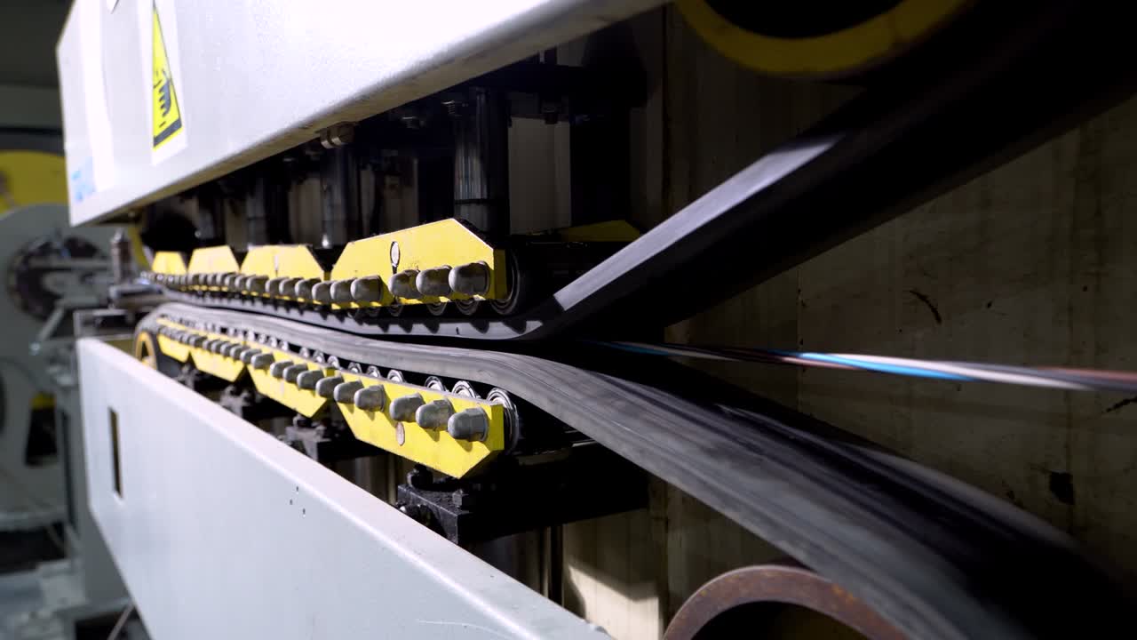 Production of copper wire, bronze cable in reels at factory. Equipment for the production of electric cable