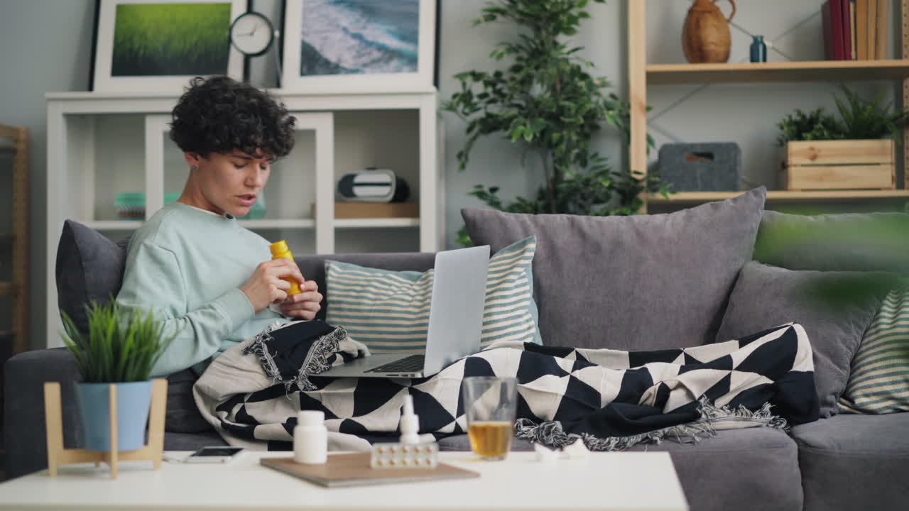 Woman having a virtual doctor visit from home due to sickness