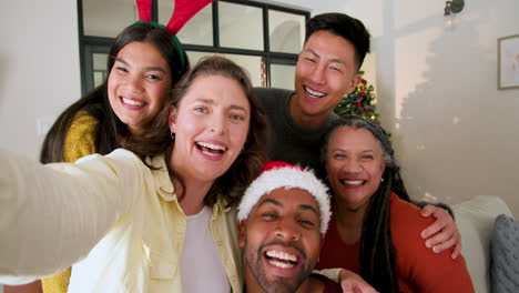taking selfie, joyful diverse family celebrating christmas together at home with smiles