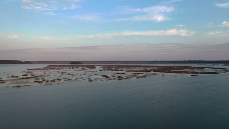 Arial-shot-over-some-islands-with-a-beautiful-skyline