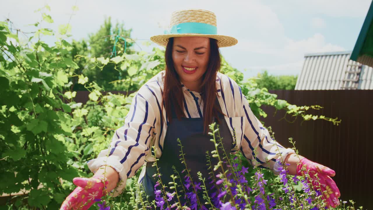 Woman gardening in a summer garden