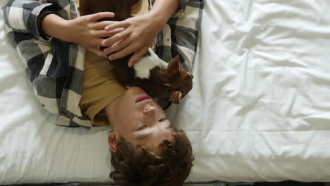 teenager and chihuahua on bed