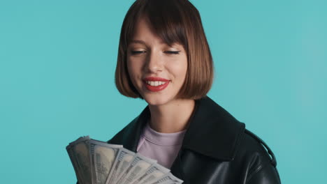 wealthy woman holding banknotes