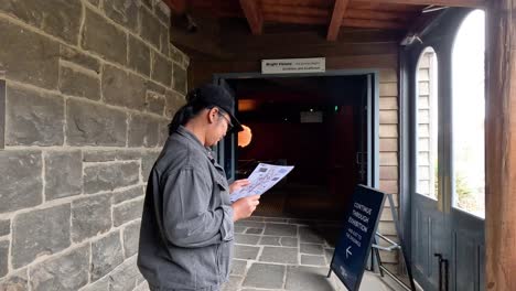 man reading map at historical site entrance