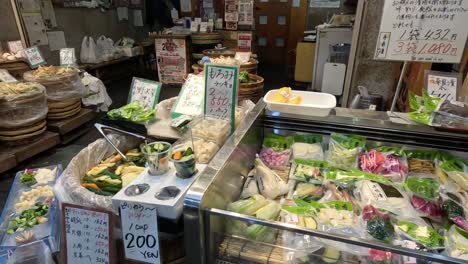 various pickles displayed at a busy market.