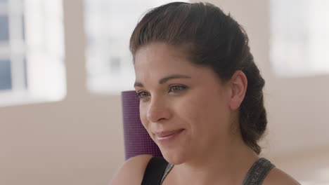 portrait-happy-caucasian-woman-smiling-enjoying-yoga-class-practicing-healthy-lifestyle-in-fitness-studio